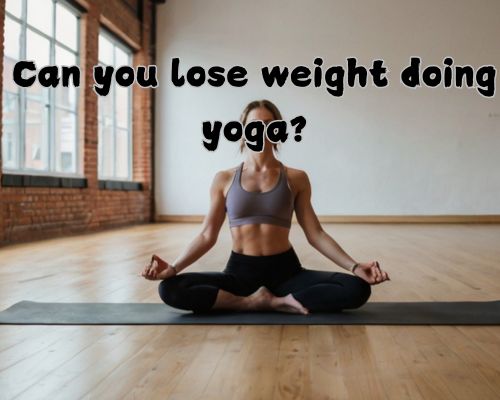 a physically fit woman doing a yoga pose in a studio